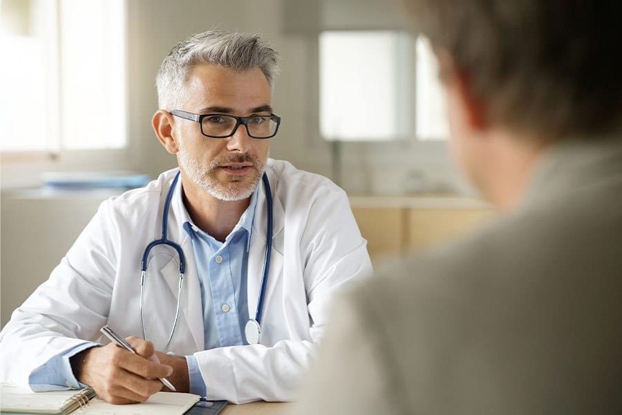 A pharmacist counseling his patient.